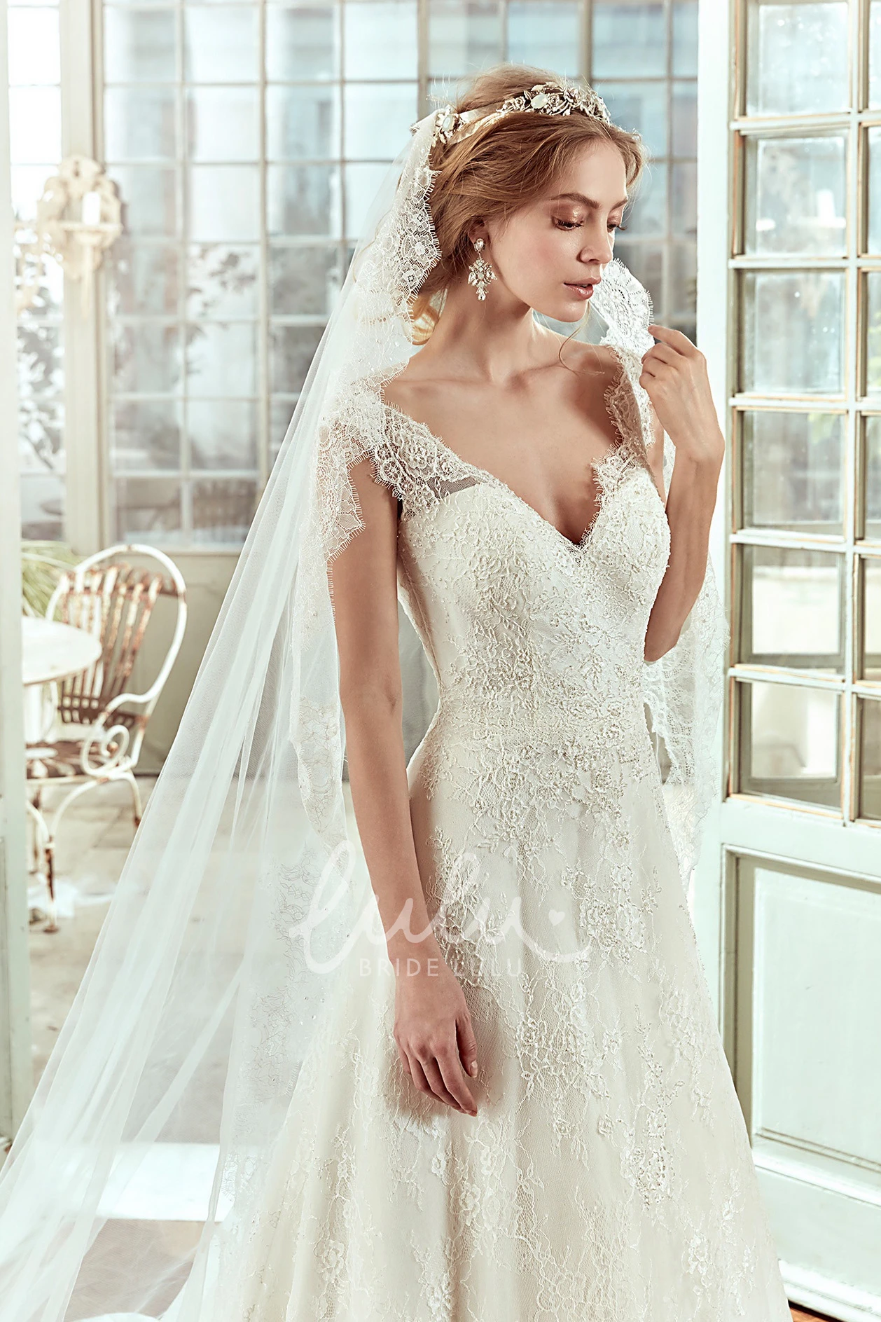 Cap-Sleeve Lace Wedding Dress with Sweetheart Neckline and Low-V Back