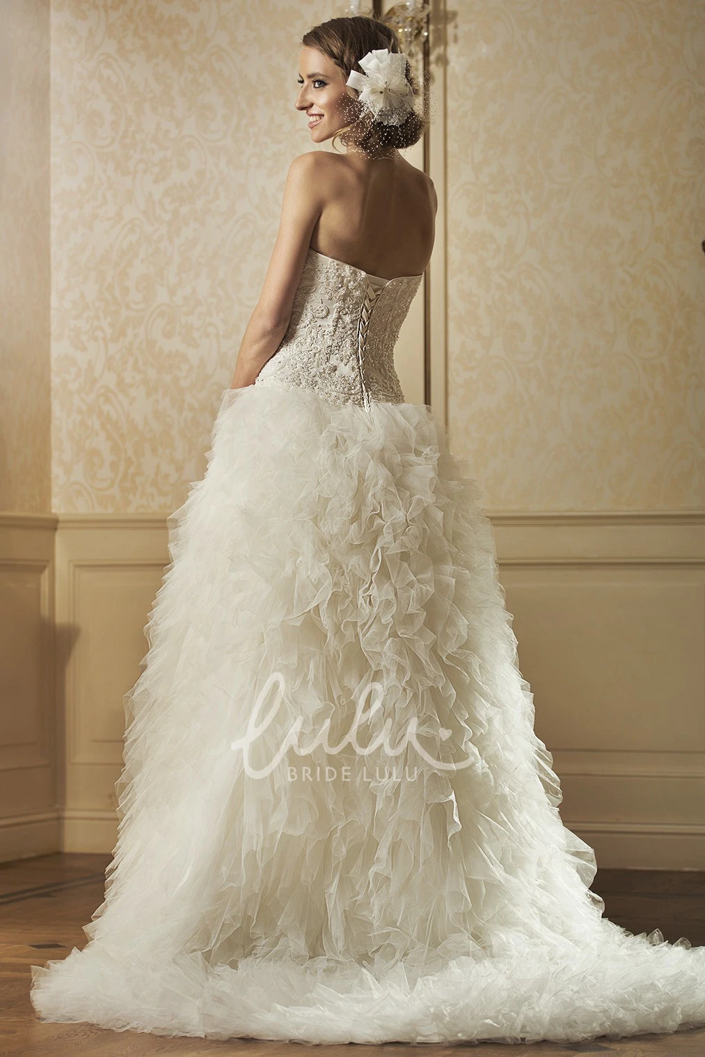 Beaded and Appliqued Ball Gown Wedding Dress with Strapless Ruffles and Tulle