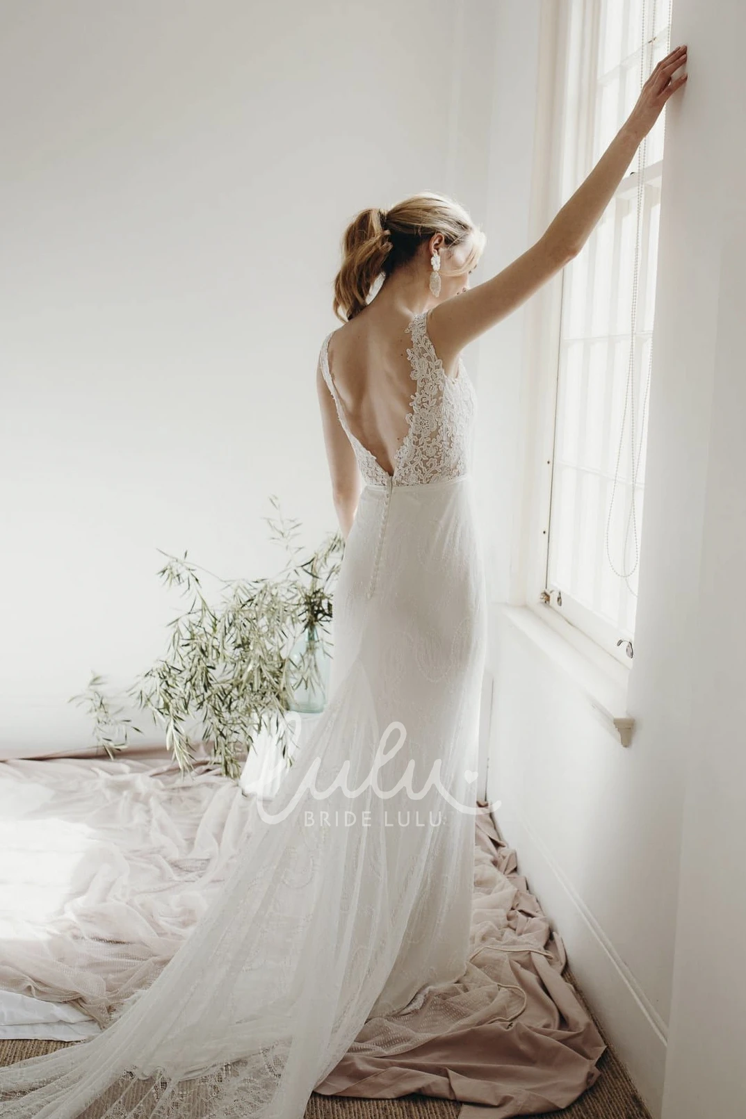 Sleeveless Lace Sheath Wedding Dress with Plunging V-neck and Deep V-back Buttons