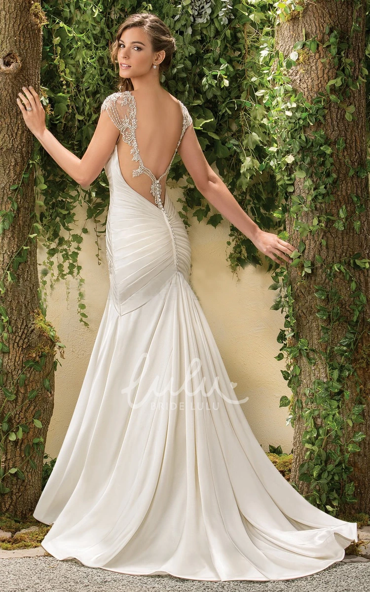 Cap-Sleeved Mermaid Wedding Dress with Beadings and Deep V-Back Elegant Cap-Sleeved Mermaid Wedding Dress with Beadings and Deep V-Back 2024