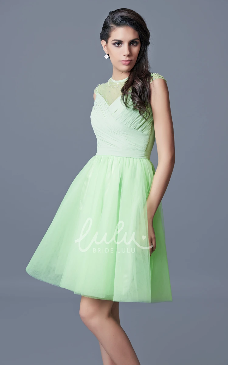 Short Tulle Homecoming Dress with Cap Sleeves Beading and Pleats Unique and Flowy