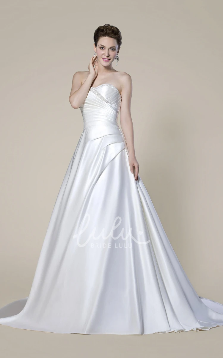 Elegant Strapless Beaded Wedding Dress with Draping and Criss Cross Back