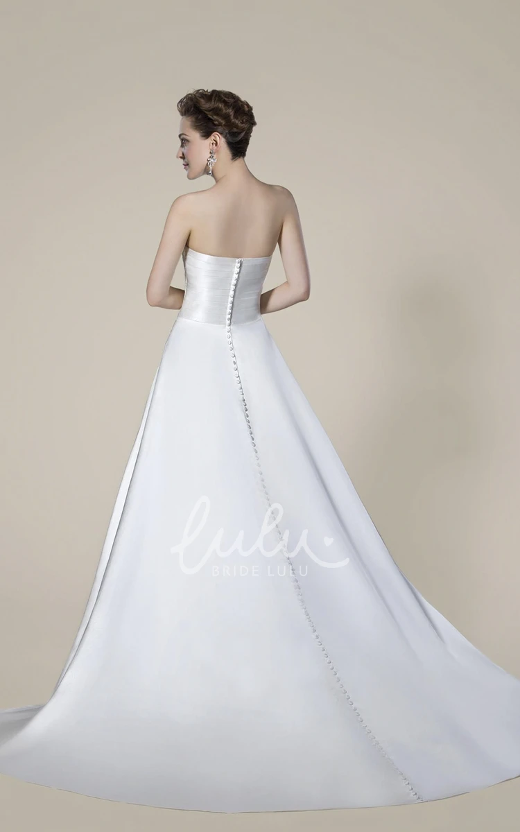 Elegant Strapless Beaded Wedding Dress with Draping and Criss Cross Back